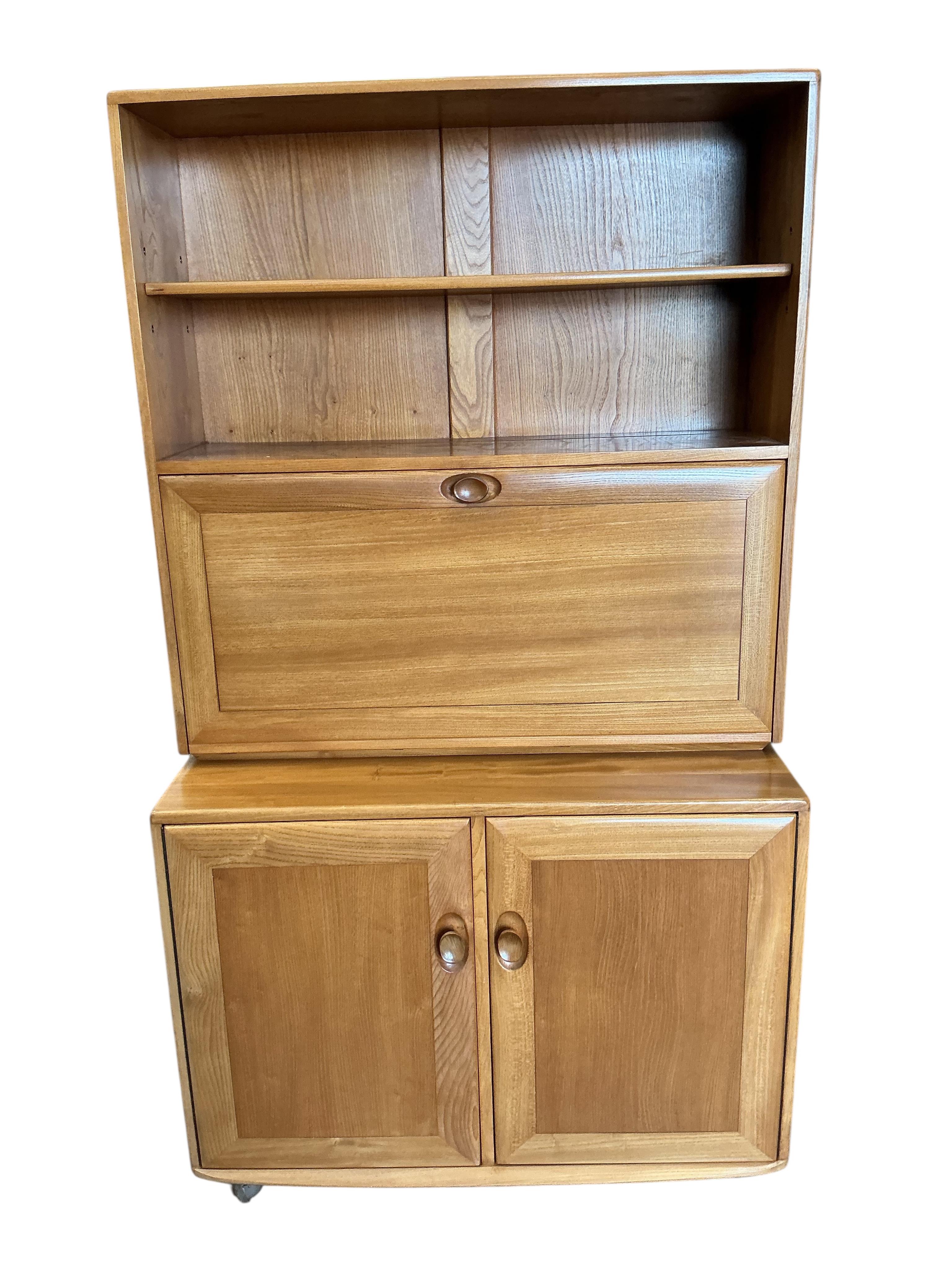 An Ercol Windsor light elm writing cabinet, width 91cm, depth 45cm, height 163cm